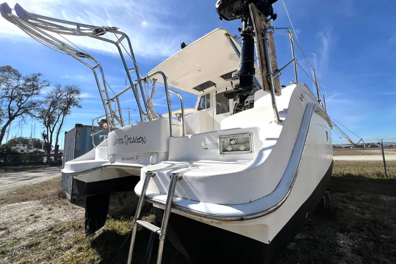 Slide: The Image of 2013 Gemini Legacy 35 catamaran, docked with clear blue sky background. - 147