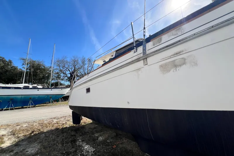 Slide: The Image of 2013 Gemini Legacy 35 sailboat on land under clear blue sky. - 152