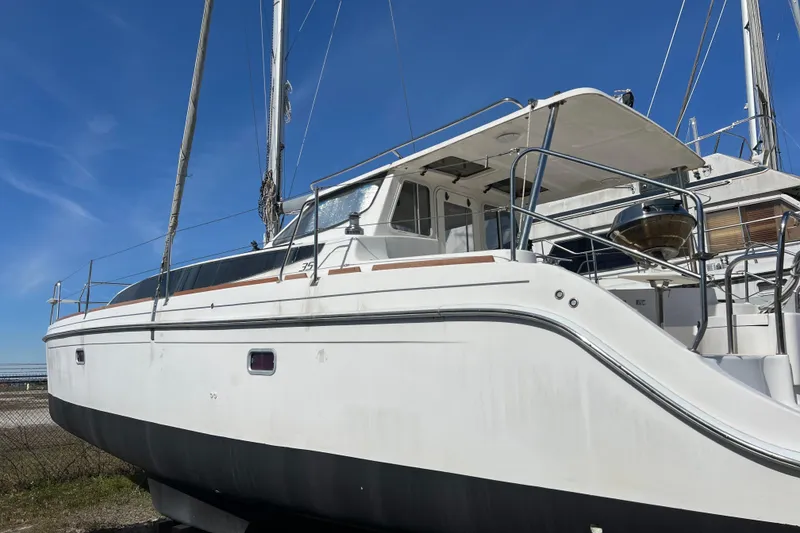 Slide: The Image of 2013 Gemini Legacy 35 sailboat on land, clear sky background. - 159