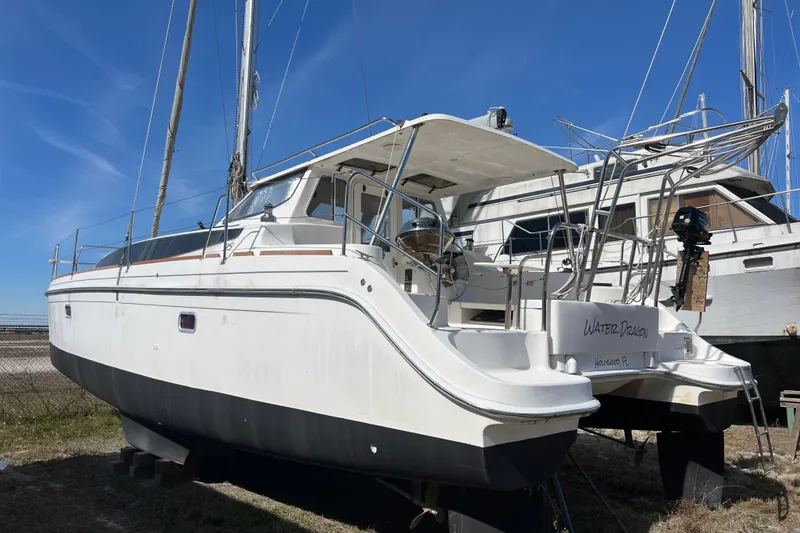 Slide: The Image of 2013 Gemini Legacy 35 catamaran on land, blue sky background. - 160