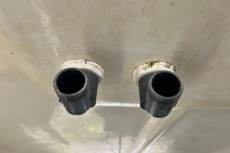 Slide: The Image of Close-up of dual exhaust outlets on 2013 Gemini Legacy 35 boat hull. - 164