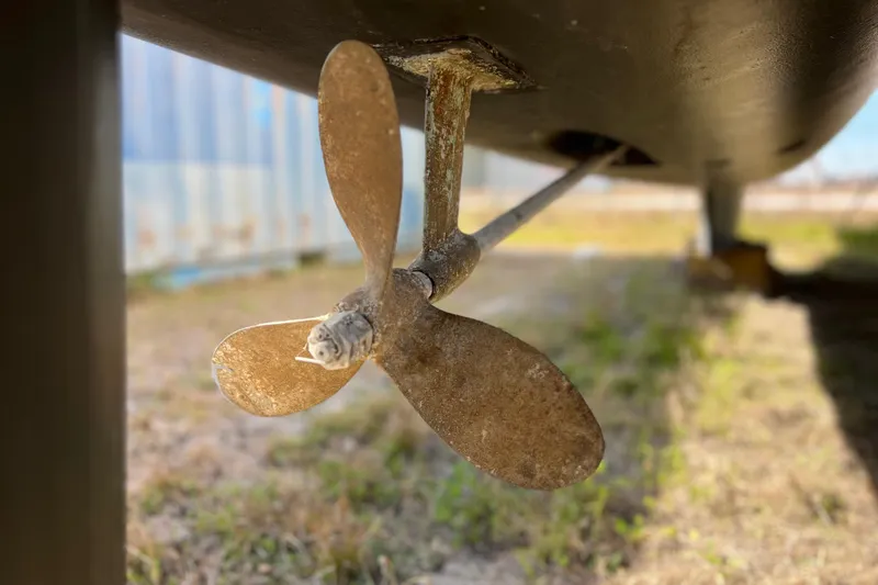 Slide: The Image of Close-up of a 2013 Gemini Legacy 35 boat propeller, showing wear and rust. - 168