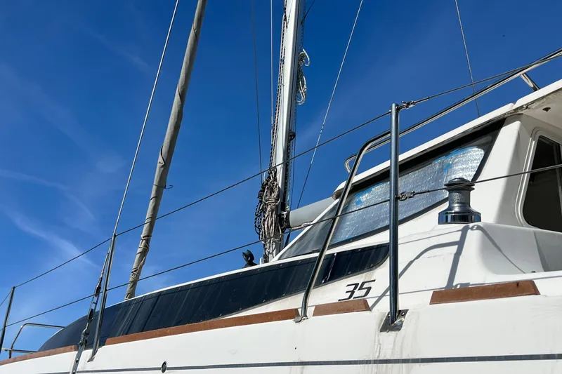 Slide: The Image of 2013 Gemini Legacy 35 sailboat against a clear blue sky. - 171