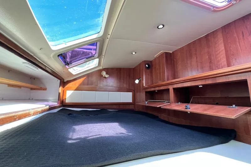Slide: The Image of Interior of 2013 Gemini Legacy 35 sailboat with wood paneling and skylights. - 18