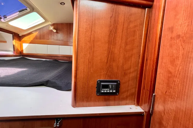 Slide: The Image of Interior of 2013 Gemini Legacy 35 boat with wood paneling and control panel. - 19