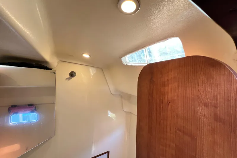 Slide: The Image of Interior of 2013 Gemini Legacy 35 boat with wooden door and ceiling lights. - 28