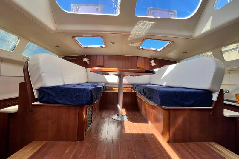 Slide: The Image of Interior of 2013 Gemini Legacy 35 catamaran with skylights and wooden furnishings. - 30