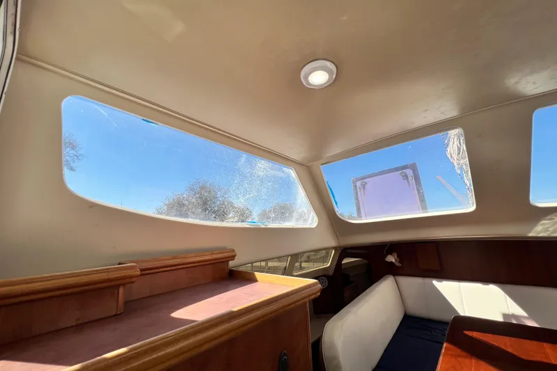 Slide: The Image of Interior of 2013 Gemini Legacy 35 sailboat with large windows and seating area. - 36