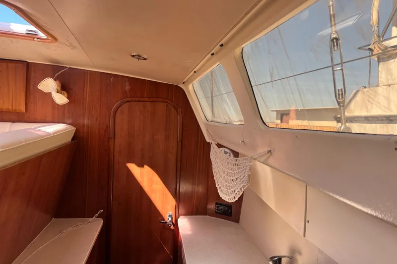 Slide: The Image of Interior of 2013 Gemini Legacy 35 sailboat with wood paneling and large windows. - 46