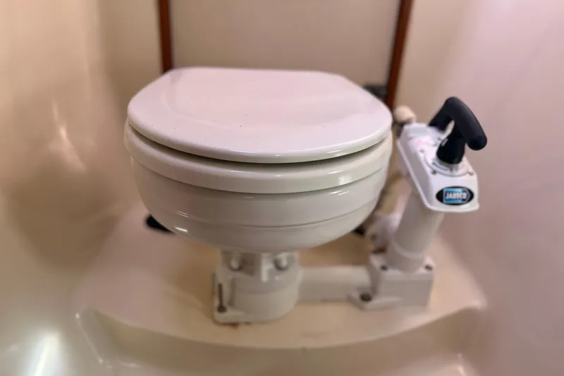 Slide: The Image of Marine toilet in 2013 Gemini Legacy 35 boat bathroom. - 54