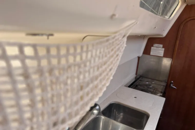 Slide: The Image of Interior of 2013 Gemini Legacy 35 sailboat kitchen with sink and stove. - 55