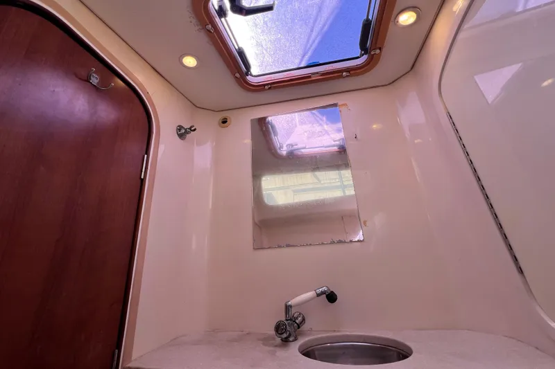 Slide: The Image of Interior of 2013 Gemini Legacy 35 boat bathroom with skylight and sink. - 58