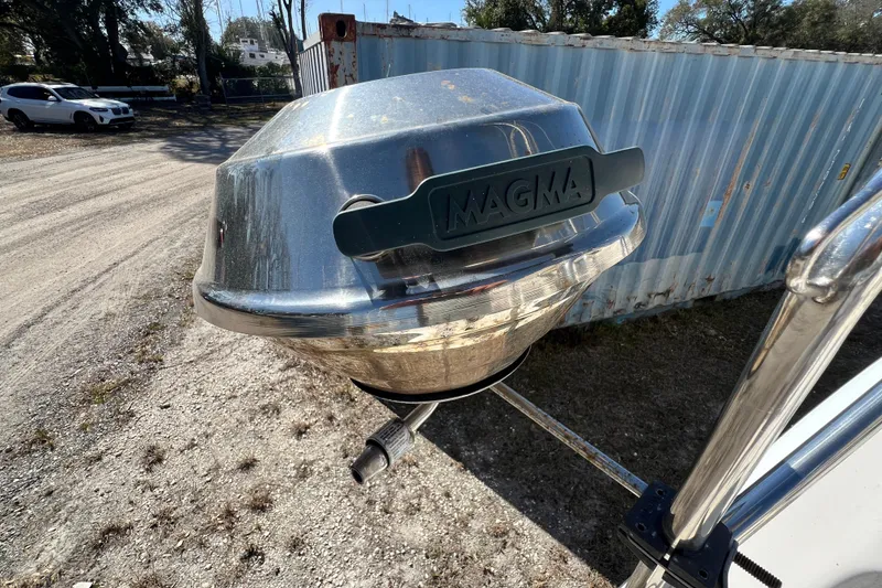 Slide: The Image of Outdoor Magma grill attached to a Gemini Legacy 35 boat, 2013 model, near a shipping container. - 69