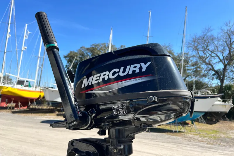 Slide: The Image of Mercury outboard motor with sailboats in background, Gemini Legacy 35, 2013 model. - 73