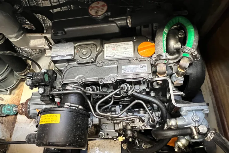 Slide: The Image of Engine compartment of a 2013 Gemini Legacy 35 sailboat, featuring Yanmar components. - 80