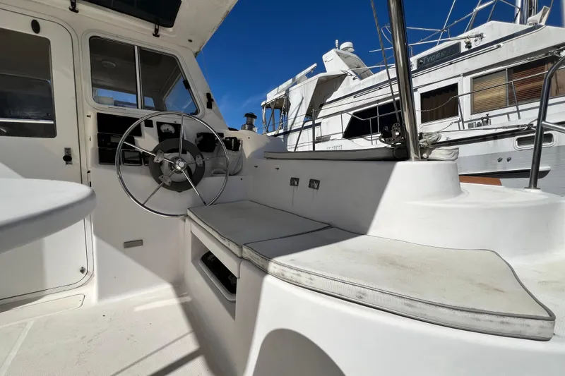 Slide: The Image of Interior view of 2013 Gemini Legacy 35 sailboat cockpit with steering wheel and seating. - 89