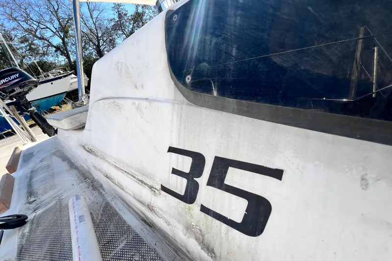 Slide: The Image of Close-up of 2013 Gemini Legacy 35 sailboat exterior with visible number "35". - 96