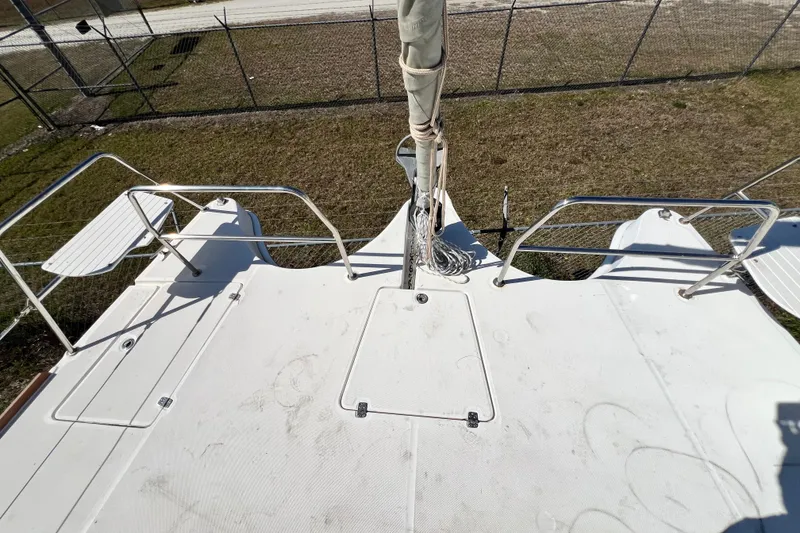 Slide: The Image of Deck view of 2013 Gemini Legacy 35 catamaran, featuring railings and seating. - 99