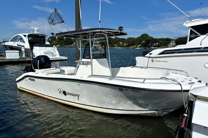 The Image of 2005 Mako 232 Center Console boat docked on a sunny day. - 0
