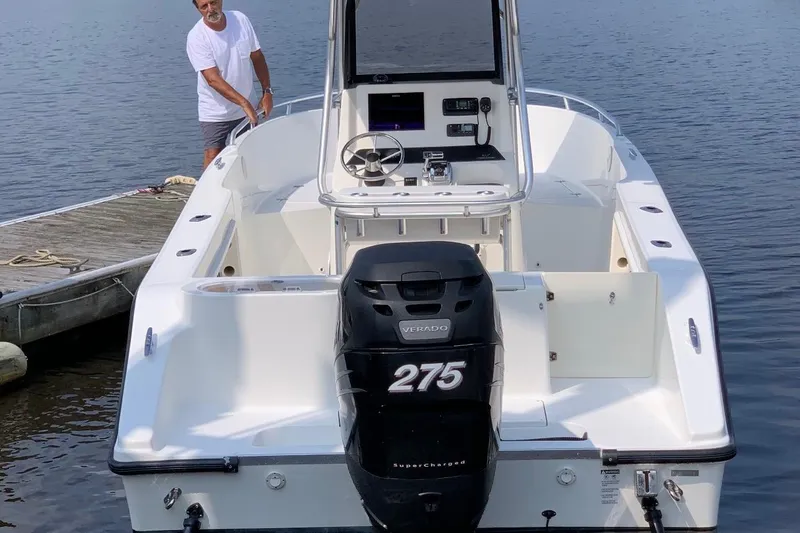 Slide: The Image of 2005 Mako 232 Center Console boat with Verado 275 engine at dock. - 7