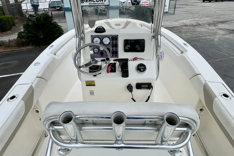 Slide: The Image of 2013 Pioneer 197 Sportfish boat console with steering wheel and controls. - 13