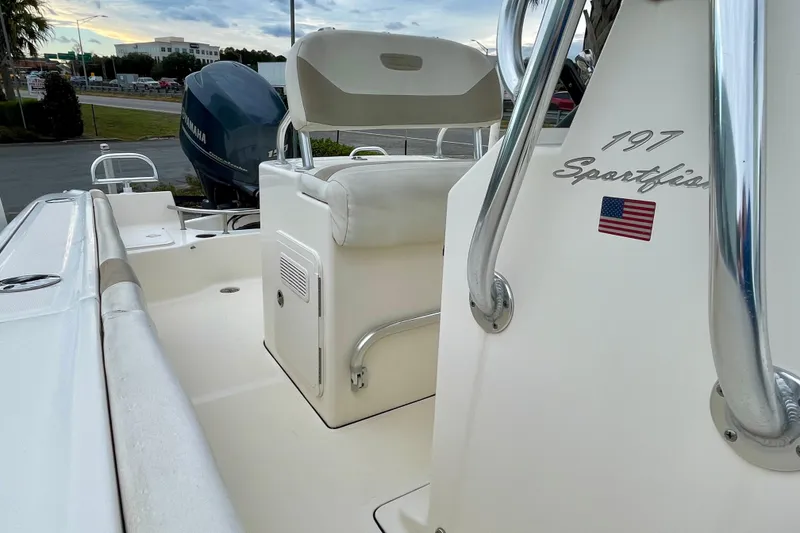 Slide: The Image of 2013 Pioneer 197 Sportfish boat interior with seating and Yamaha engine. - 17