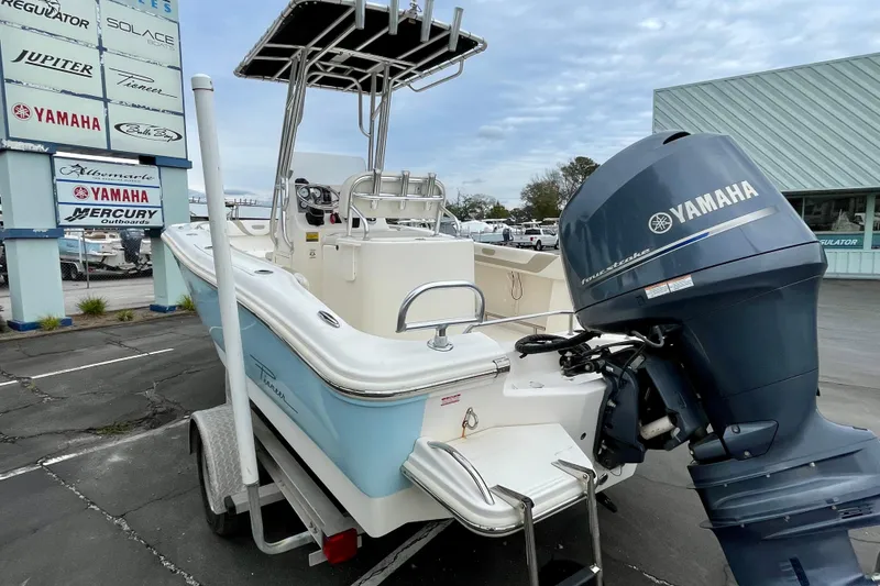 Slide: The Image of 2013 Pioneer 197 Sportfish boat with Yamaha outboard motor on a trailer. - 8