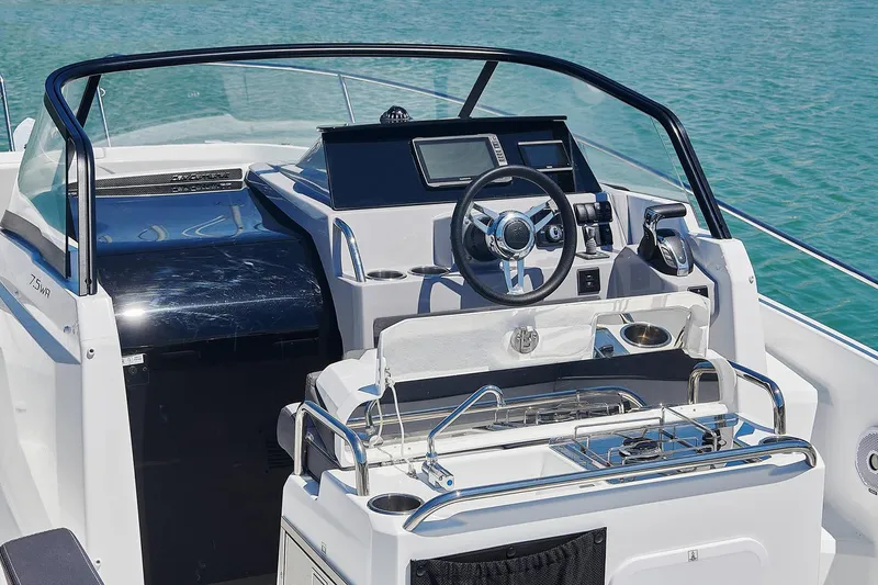 Slide: The Image of Manufacturer Provided Image: 2025 Jeanneau Leader 7.5 WA Series 3 boat interior with modern helm and seating. - 4