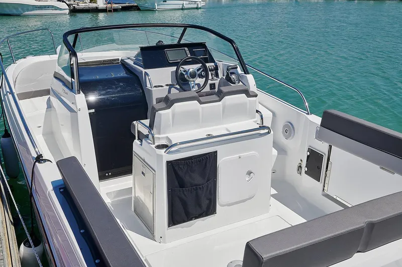 Slide: The Image of Manufacturer Provided Image: 2025 Jeanneau Leader 7.5 WA Series 3 cabin interior with seating, sink, and cushions. - 5