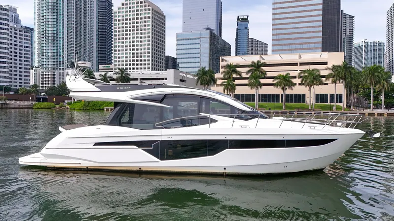 Slide: The Image of 2020 Galeon 510 Sky yacht against urban skyline. - 1