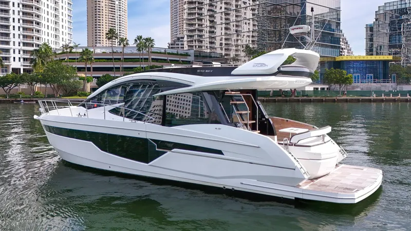 Slide: The Image of Luxury yacht Galeon 510 Sky 2020 in harbor, modern architecture in background. - 4