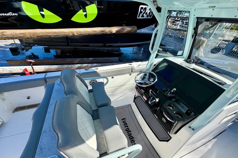 Slide: The Image of 2023 Everglades 285 Center Console boat interior with modern helm and seating. - 10