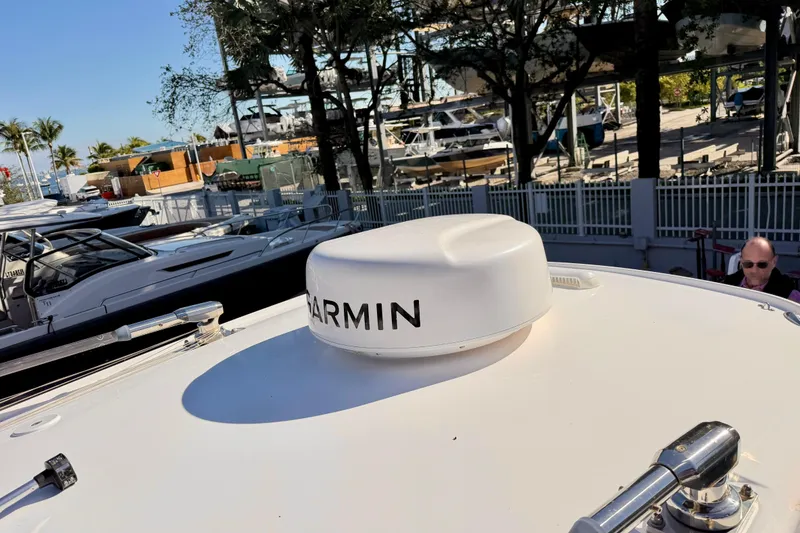 Slide: The Image of 2023 Everglades 285 Center Console with Garmin equipment at a marina. - 17