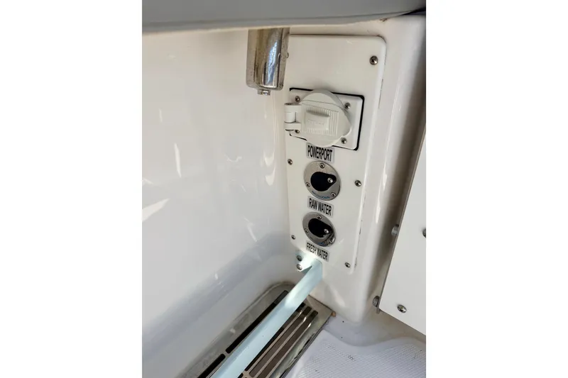 Slide: The Image of 2023 Everglades 285 Center Console power and water ports. - 18