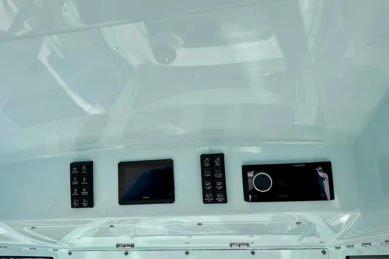 Slide: The Image of 2023 Everglades 285 Center Console dashboard with modern controls and display screens. - 20