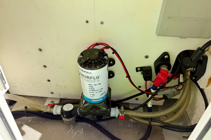 Slide: The Image of 2023 Everglades 285 Center Console boat interior wiring and pump system. - 22