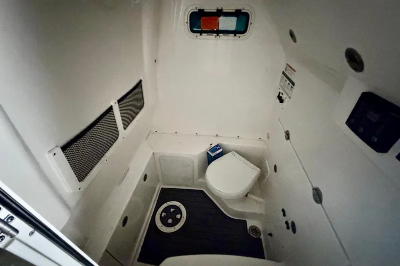 Slide: The Image of 2023 Everglades 285 Center Console boat interior with seating and speakers. - 7