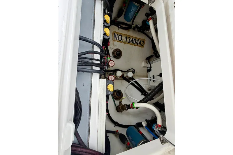 Slide: The Image of 2023 Everglades 285 Center Console boat with cushioned seating and storage compartments. - 8