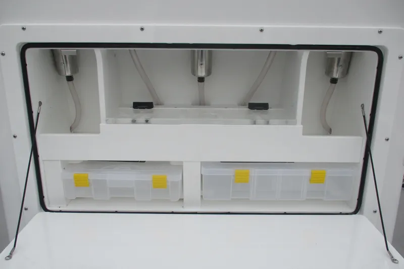 Slide: The Image of Storage compartment of 2026 Bluewater 25t boat with organized tackle boxes. - 12