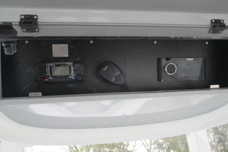 Slide: The Image of 2026 Bluewater 25t boat dashboard with communication and audio equipment. - 17