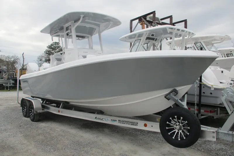 Slide: The Image of 2026 Bluewater 25t boat on trailer, displayed outdoors. - 2