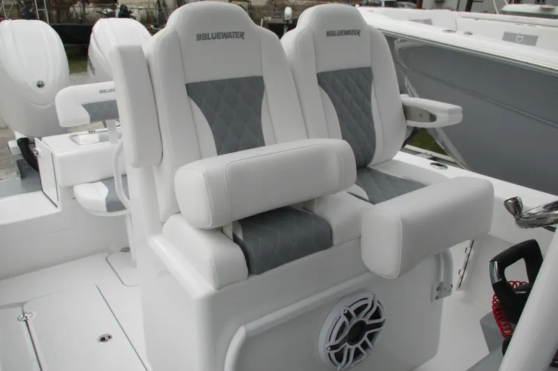 Slide: The Image of 2026 Bluewater 25t boat interior with luxurious white and gray seating. - 8