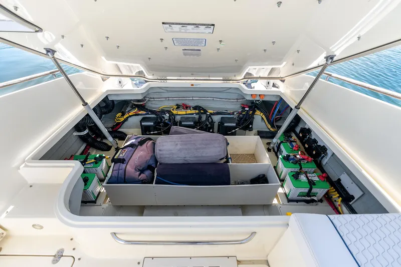 Slide: The Image of 2021 Chris-Craft Launch 35 GT OB engine compartment with batteries and storage. - 17