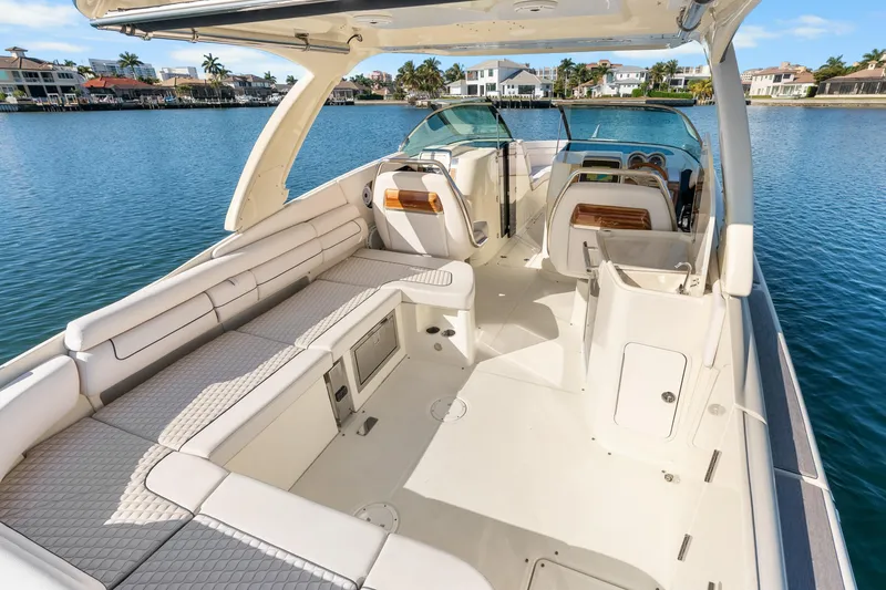 Slide: The Image of 2021 Chris-Craft Launch 35 GT OB boat interior with luxurious seating and waterfront view. - 19