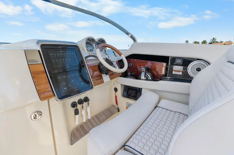 Slide: The Image of 2021 Chris-Craft Launch 35 GT OB helm with modern controls and luxurious seating. - 23