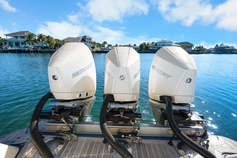 Slide: The Image of Triple Mercury outboard engines on 2021 Chris-Craft Launch 35 GT OB, docked in scenic marina. - 24