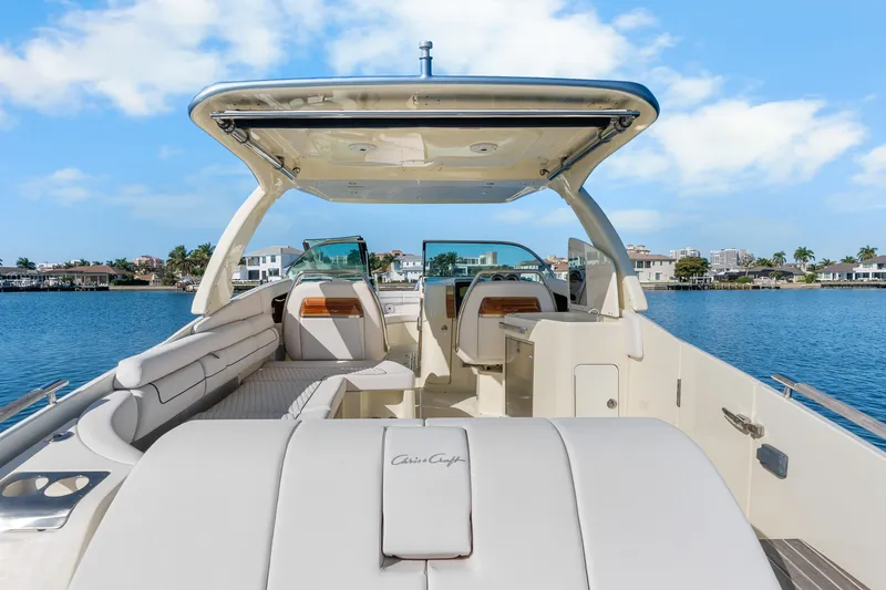 Slide: The Image of 2021 Chris-Craft Launch 35 GT OB boat interior with luxurious seating and waterfront view. - 26