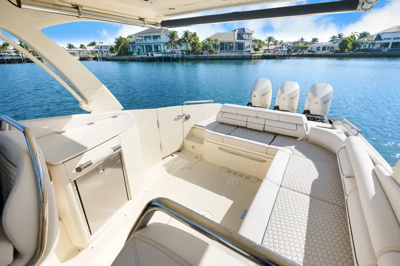 Slide: The Image of 2021 Chris-Craft Launch 35 GT OB luxury boat interior with seating and water view. - 29
