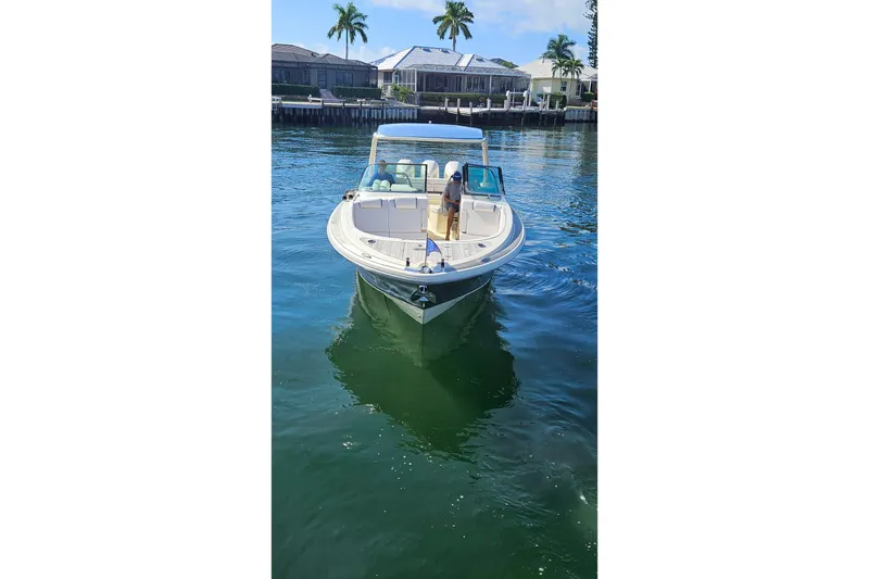 Slide: The Image of 2021 Chris-Craft Launch 35 GT OB, aerial view, sleek design, triple outboard engines. - 4