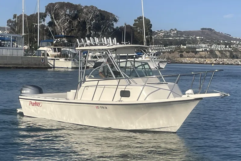 The Image of 2006 Parker 2310 boat with Yamaha engine in a marina setting. - 0